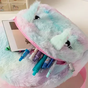 Close-up of rainbow plush unicorn backpack showing fuzzy texture and pens