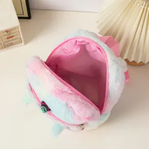 Top view of plush unicorn backpack showing open pink interior and soft faux fur texture