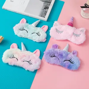 Set of four colorful plush unicorn sleep masks with shiny silver horns
