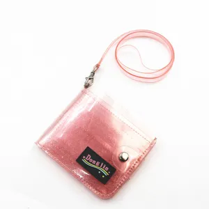 Close-up of pink glittery transparent PVC neck strap wallet with snap closure detail