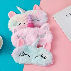 Detailed macro view of soft plush unicorn sleep masks in multiple cute pastel shades