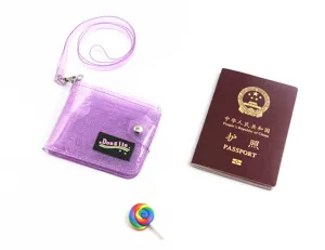 Detailed view of a purple glitter PVC ID card holder with lanyard and snap closure