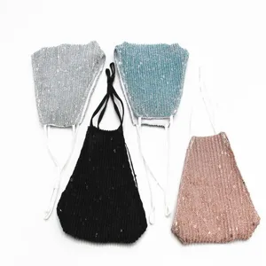 Detail view of four stylish sequined breathable sun protection face masks in various colors