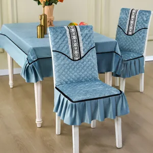 Elegant blue velvet quilted dining chair cover set with ruffled edges and lace decor