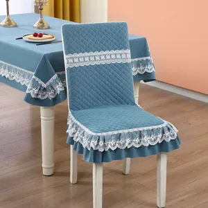Elegant blue quilted chair cover and tablecloth set with white lace trim for dining room