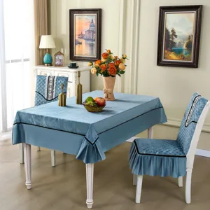 Blue quilted chair cover and tablecloth set with elegant black lace trim detail.