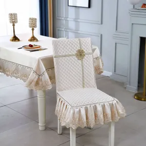 Elegant champagne quilted chair cover and tablecloth set featuring delicate lace embroidery