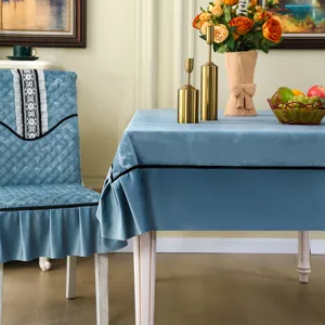 Close-up of elegant blue velvet chair cover and matching tablecloth with lace trim