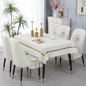 Detail view of white Nordic tablecloth and matching elastic curved chair cover set