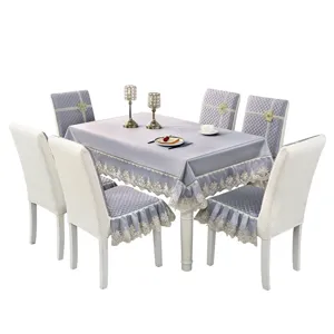 Quilted grey dining table set including lace tablecloth and matching chair covers