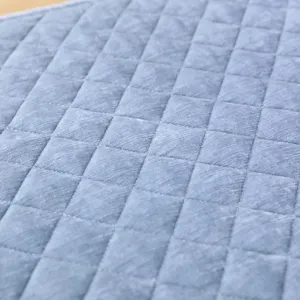 Close-up detail of thickened velvet quilted dining chair cover in blue-grey fabric