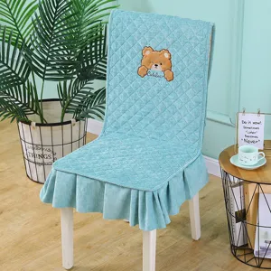 Light blue quilted chair cover with cute bear embroidery and elegant ruffled skirt detail.