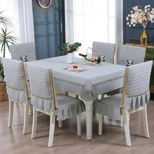 Grey dining set featuring a tablecloth and chair covers with cute panda embroidery and lace