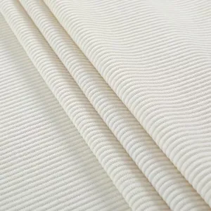 Macro detail showing the texture of white ribbed thickened stretch fabric for chair covers