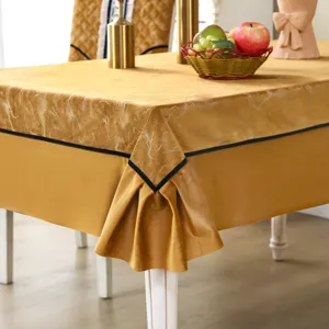 Macro detail of golden marble pattern tablecloth with matching thickened elastic chair covers
