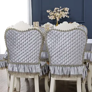 Close-up detail showing the texture and lace trim of a silver quilted European-style chair cover
