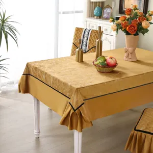 Elegant golden tablecloth and matching chair covers with marble texture details