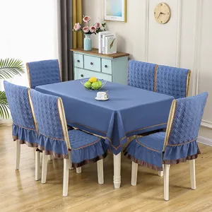 Detailed view of elegant blue fabric tablecloth and matching ruffled chair cover set