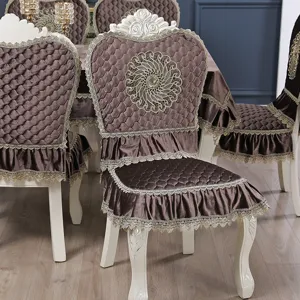 Detail of luxury European brown quilted velvet chair cover with lace trim and ruffles.