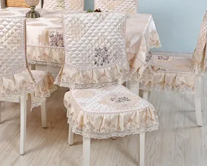 Close-up of European style quilted chair cover with elegant lace and floral embroidery