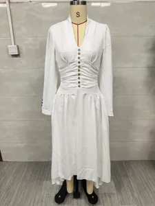 Detailed view of white elegant V-neck long-sleeve dress with ruched waist and button accents