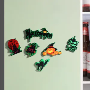 Detailed view of Halloween wooden fridge magnets with fluorescent pumpkin and cat designs