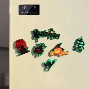 Detailed macro view of vibrant Halloween themed magnets on a smooth fridge surface