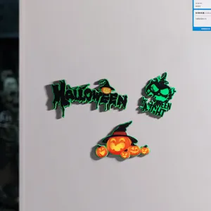 Macro view of fluorescent wooden Halloween fridge magnets with pumpkin and skull motifs