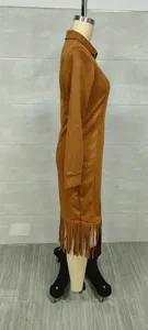Side view of brown faux suede fringe dress with western cowboy style and long sleeves