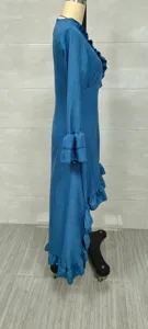 Side view detail of a blue Bohemian long-sleeved dress with ruffle hem on a mannequin stand