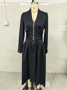 Elegant black V-neck long-sleeve maxi dress with pleated waist and button detail shown on mannequin