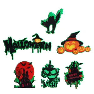 Detailed view of fluorescent Halloween wooden fridge magnets set with various spooky icons