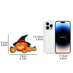 Detailed size guide for the Halloween pumpkin fridge magnet with smartphone comparison