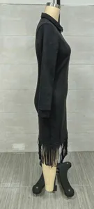 Close-up side view detail of a black suede dress featuring stylish long fringe hem