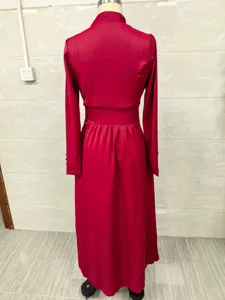 Elegant red long sleeve maxi dress back view with cinched waist and pleated skirt details.