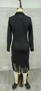 Back view of a minimalist black suede long sleeve dress with stylish fringe detail on mannequin
