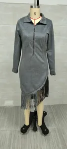 Close-up detail of gray suede western cowboy style dress with fringe tassel hemline