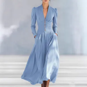 Elegant light blue maxi dress featuring a V-neck, puff sleeves, and a cinched buttoned waist