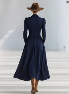 Back view of elegant navy blue maxi dress with puff sleeves and cinched waist