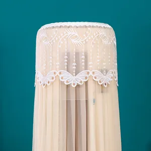 Close-up of elegant champagne lace embroidery on cylindrical air conditioner dust cover