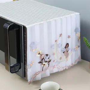 Close-up view of elegant lace microwave dust cover with moon and girl embroidery detail