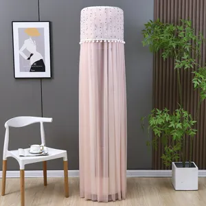 Macro view of pink lace vertical air conditioner cover featuring white pom-pom trim