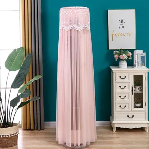 Pink lace cylindrical air conditioner dust cover in a cozy home living room setting