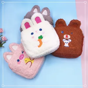 Collection of cute plush cartoon animal pouches for coins makeup and sanitary napkins storage