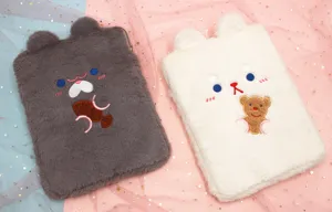 Close-up of cute plush iPad sleeves in grey and white with animal ear designs