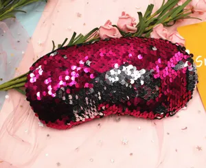 Close-up detail of reversible magenta and silver sequins on the mermaid eye mask