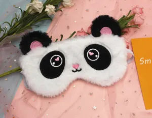 Close-up of a soft plush panda sleep eye mask featuring cute embroidery details.