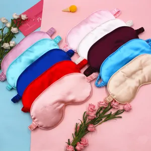 Detailed view of various colorful silk satin sleep eye masks with elastic straps.