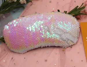 Close-up of reversible iridescent mermaid sequins on double-sided travel eye mask