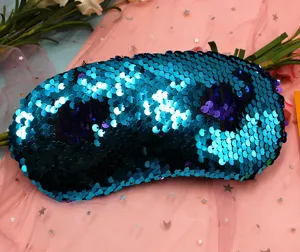 Close-up detail showing the shimmering reversible blue and purple sequins on a mermaid sleep mask